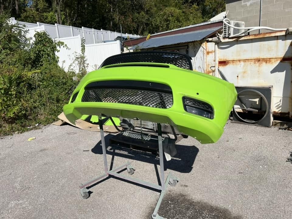 The front clip off the car, painted and waiting to go back on