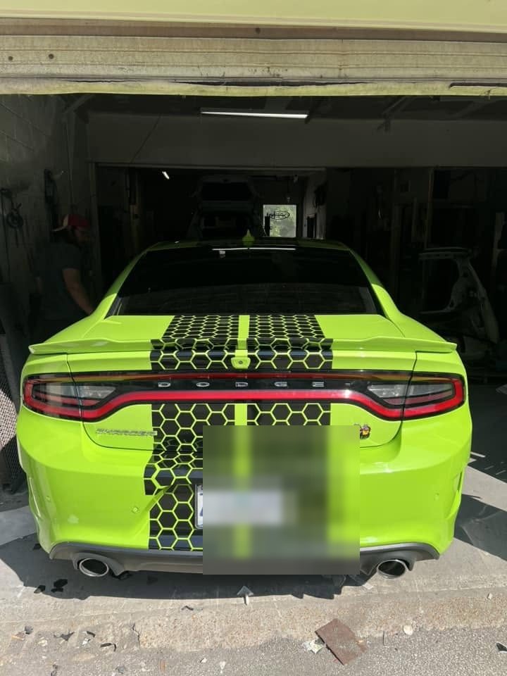The Charger's tail panel, stripes lined up across the gap