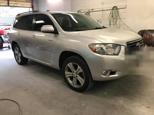 A silver Highlander, panel work done