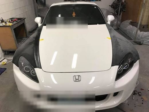 A white S2000 with the hood painted