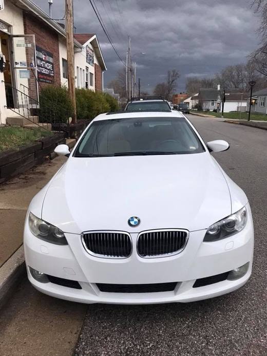 A white BMW coupe, finished
