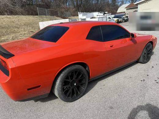 The orange Challenger from the rear quarter