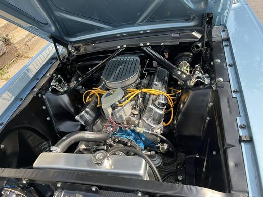 The Mustang's engine bay, polished and blue